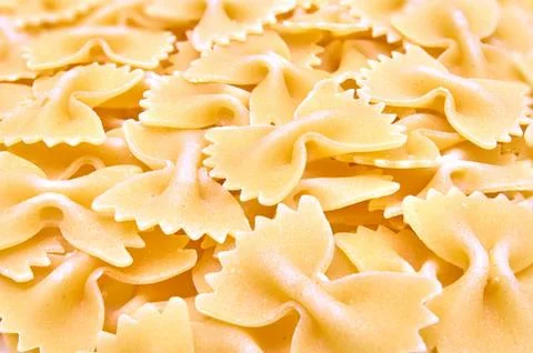 Background of paste in the form of bows. Stock Photos