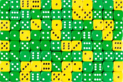 Background patteren of random ordered green and yellow dices Stock Photos
