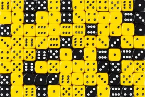 Background patteren of random ordered yellow and black dices Stock Photos