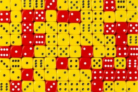 Background patteren of random ordered yellow and red dices Stock Photos