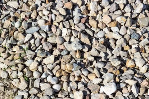 Background pattern, Crushed stone and small stones filled with sun Foto stock