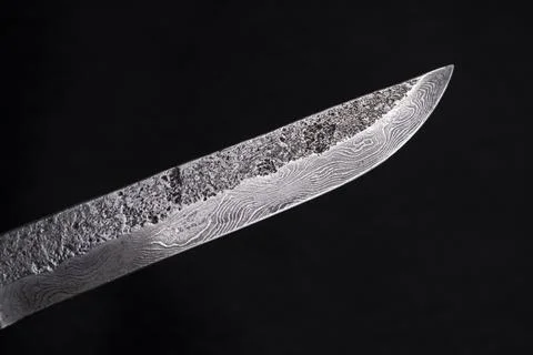 Background with a pattern of Damascus steel 库存照片