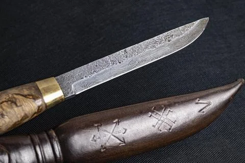 Background with a pattern of Damascus steel 库存照片