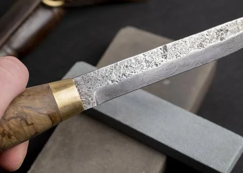 Background with a pattern of Damascus steel Stock Photos