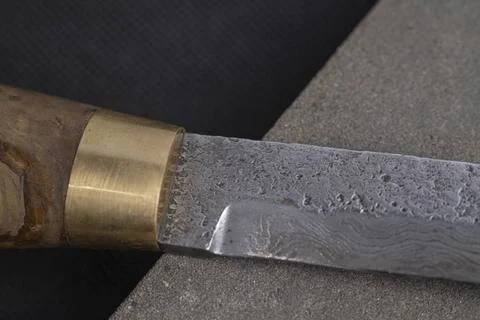 Background with a pattern of Damascus steel Stock Photos
