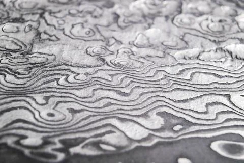 Background with pattern of damask steel. Close up. Macro shot of a damascus k Foto stock