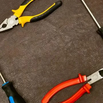 Background pattern hand tool nippers screwdriver frame base dark copy space Stock Photos