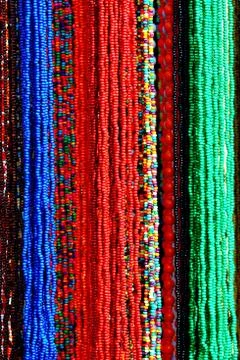 Background pattern of multicolored natural stone beads Stock Photos