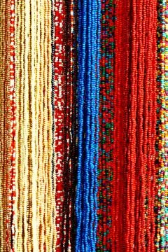 Background pattern of multicolored natural stone beads Stock Photos