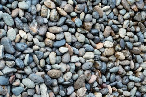 Background Pattern, Naturally Polished River Rock Pebbles Background. Stock Photos