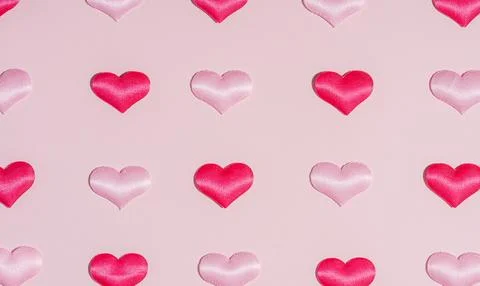Background pattern pink and red heart on peach colored paper Stock Photos