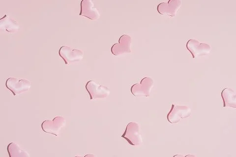 Background pattern pink heart on peach colored paper Stock Photos