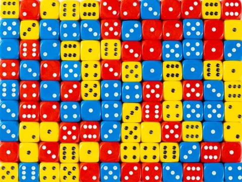 Background pattern of random ordered red, blue and yellow dices Stock Photos