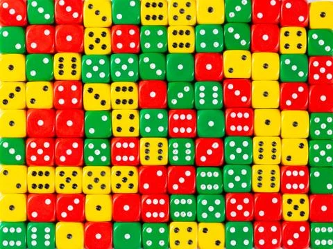 Background pattern of random ordered red, green and yellow dices Stock Photos