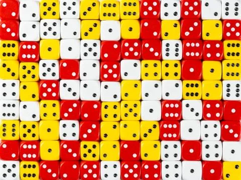 Background pattern of random ordered white, red and yellow dices Stock Photos