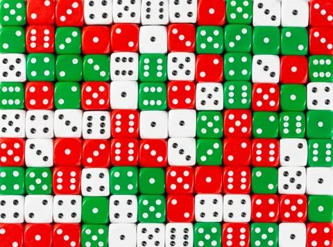 Background pattern of random ordered white, red and green dices Stock Photos