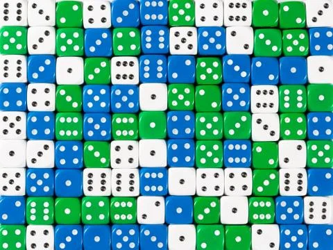 Background pattern of random ordered white, blue and green dices Stock Photos
