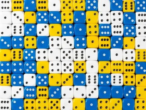 Background pattern of random ordered white, blue and yellow dices Stock Photos