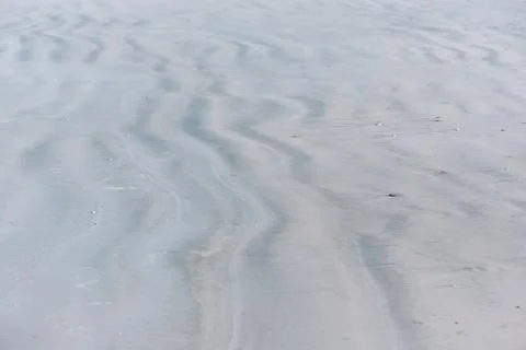 Background pattern of sand on the beach. Stock Photos