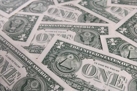 Background Pattern of Scattered One US Dollar Bills Showing Reverse Side Sy.. Stock Photos