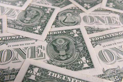 Background Pattern of Scattered One US Dollar Bills Showing Reverse Side Sy.. Stock Photos
