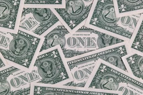 Background Pattern of Scattered One US Dollar Bills Showing Reverse Side Sy.. Stock Photos
