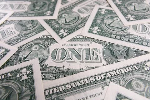 Background Pattern of Scattered One US Dollar Bills Showing Reverse Side Sy.. Foto stock