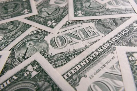 Background Pattern of Scattered One US Dollar Bills Showing Reverse Side Sy.. Foto stock