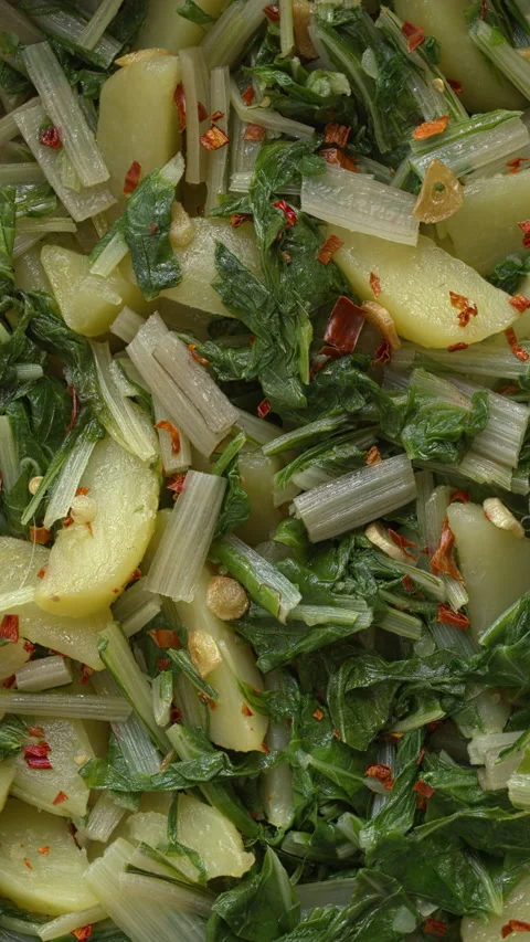 Background pattern of South Croatian Blitva s Krumpirom dish. Vertical video. Stock Footage 313634216