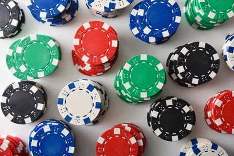 Background with pattern of stacks of colorful chips top view Stock Photos