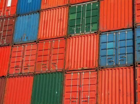 Background pattern of a wall of shipping containers Stock Photos