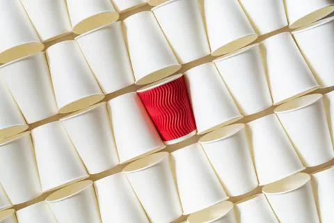 Background pattern of white paper cups with red cup in the middle Stock Photos