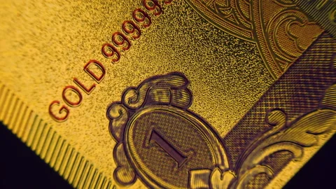 Background of a patterned embossed golden colored with digit 1, 999 gold  Stock Footage 151994000