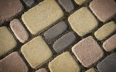 Background of Patterned surface of different colors made of concrete. Stock Photos