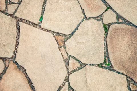 Background paved from natural stone of irregular shape Stock Photos