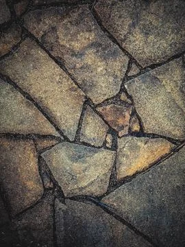 Background paved from natural stone of irregular shape Stock Photos