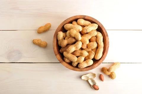 Background of the peanuts with the shell not peeled Stock Photos