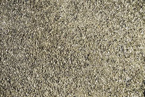Background of pebbles on the beach, orange, white and gray small smooth stones Stock Photos