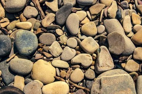 Background of pebbles of different sizes Stock Photos