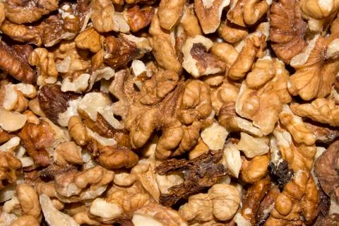 Background of peeled walnuts. Stock Photos