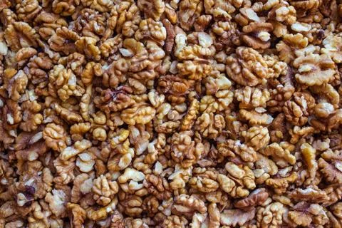 Background of peeled walnuts. Stock Photos