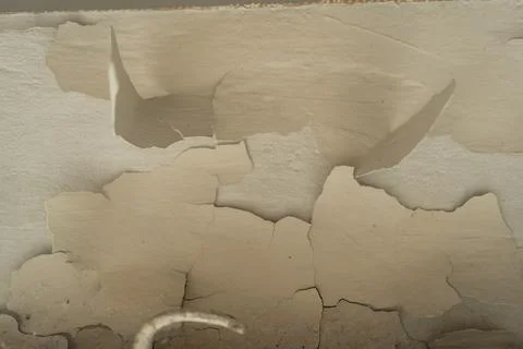 Background of Peeling ceiling paint in old room Stock Photos