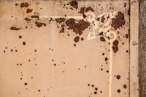 Background of peeling paint and rusty old metal with white frame ornament Stock Photos