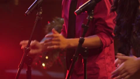 Background performers singing and dancing in live performance Stock Footage 136336081