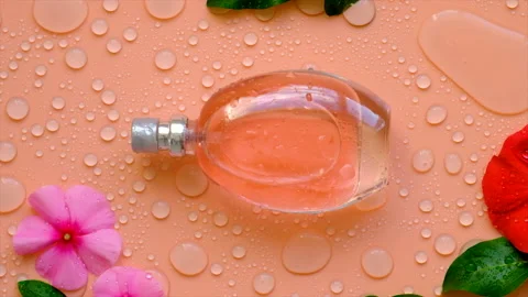 Background with perfume water drops and flowers. Selective focus. Stock Footage 208765210
