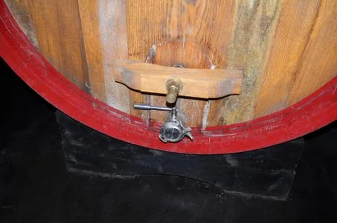 Background perspective inside a winecellar full of wooden barrels Stock Photos