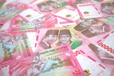 Background of piles of 100,000 rupiah notes Stock Photos