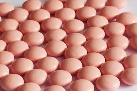 Background pink pills Stock Photos