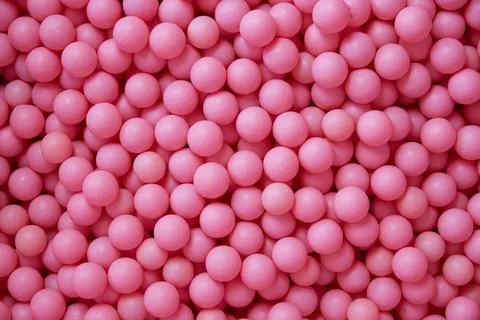 Background of pink plastic balls. Copy space. Stock Photos