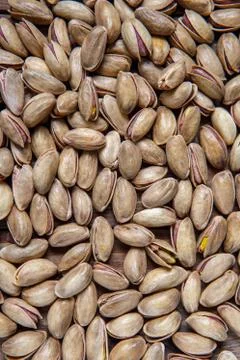 Background of pistachio nuts. Flat layout. Stock Photos